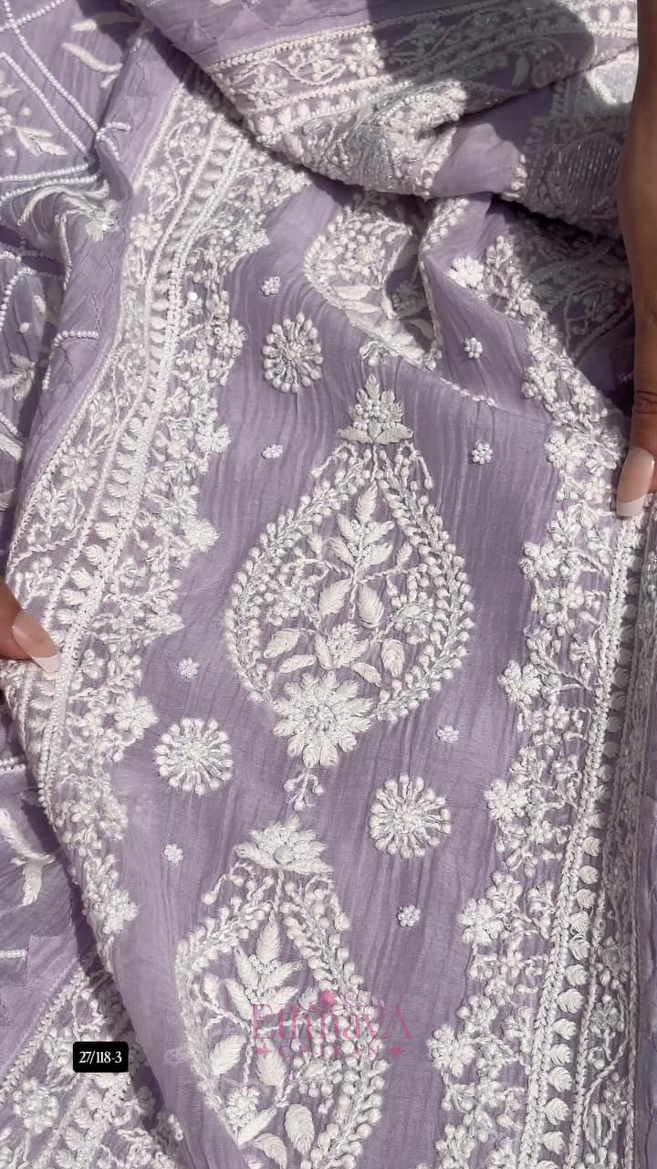 Our pure Mul Chanderi 2-piece set in lavender, finished with handcrafted Moti & Cutdana work, is designed for…